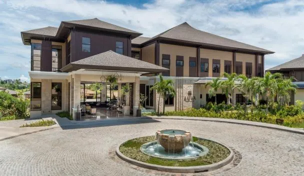 Anya Resort Tagaytay porte-cochere with stone paving and a fountain at the entrance