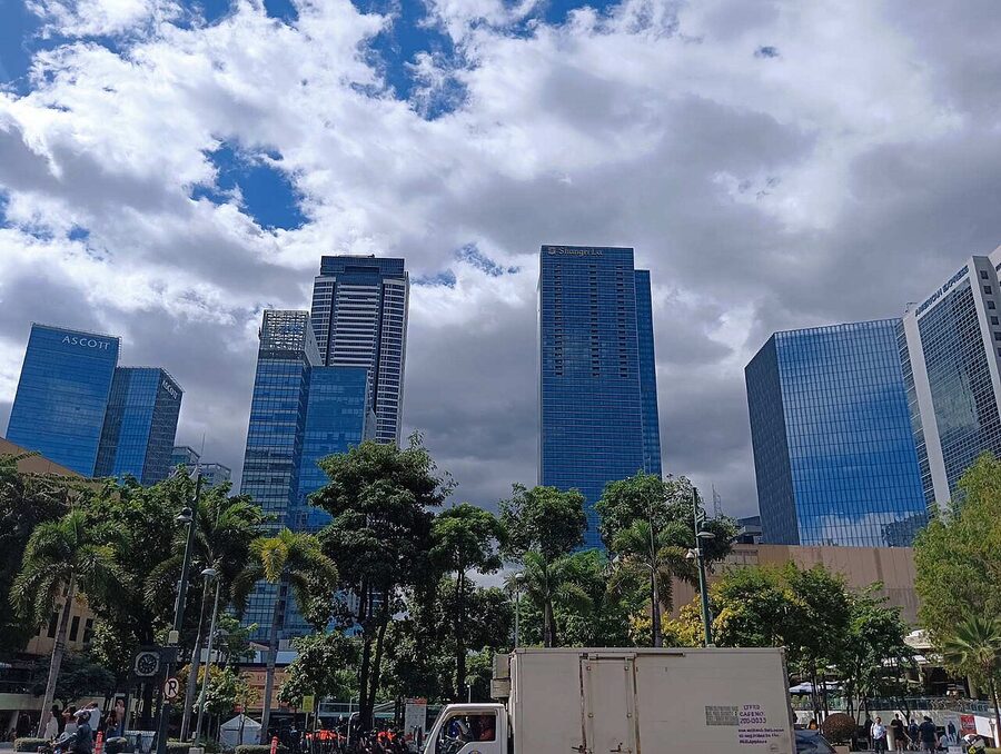 BGC skyline showing Ascott and Shangri-La The Fort towers above palm-lined plaza