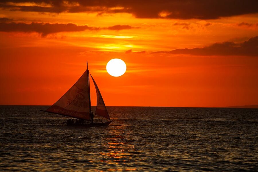 Paraw sailboat at sunset on Boracay White Beach