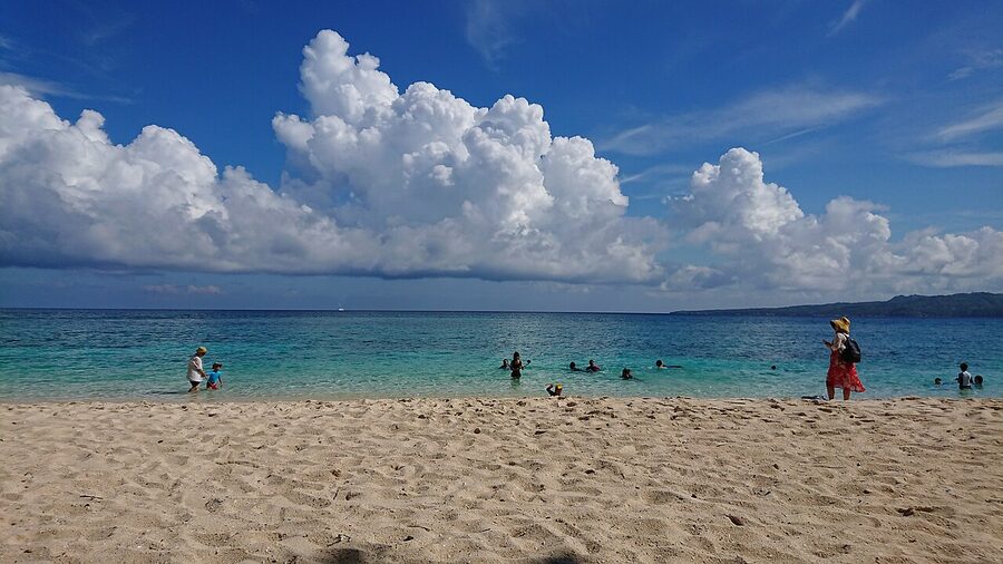Puka Beach Boracay with white sand and clouds
