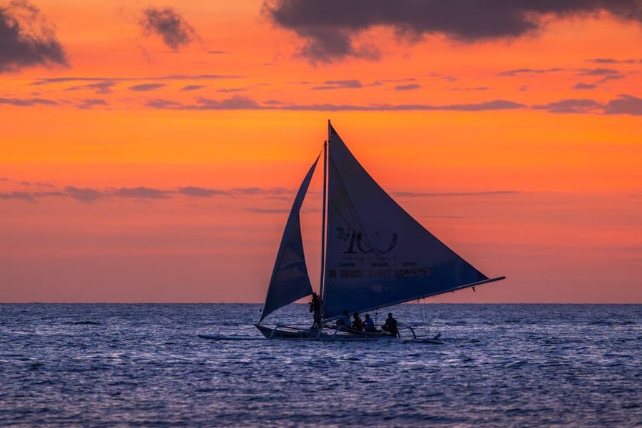 Paraw sailboats on Boracay at twilight