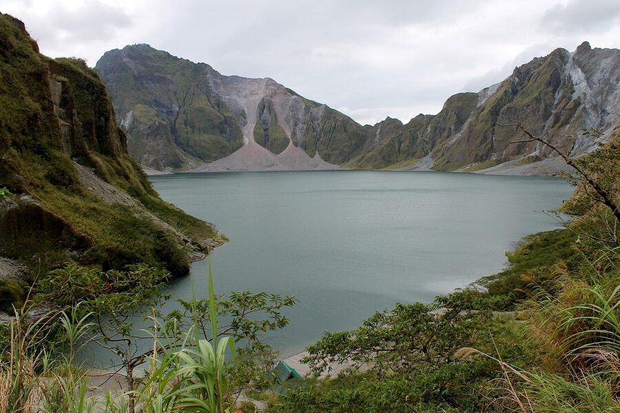 Mount Pinatubo crater lake viewed from the rim with surrounding caldera walls