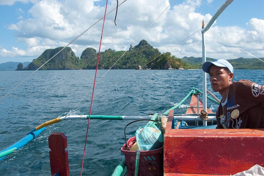 Traditional bangka outrigger boat anchored in El Nido Bay, Palawan