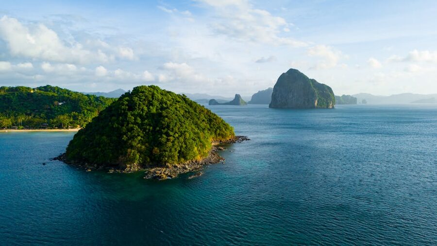 Aerial view of green islands and turquoise water near El Nido, Philippines