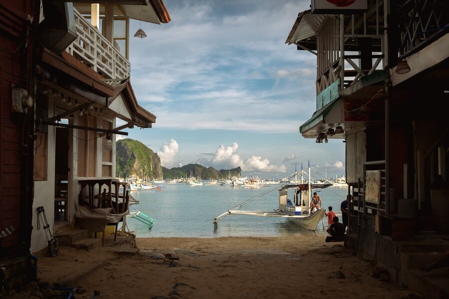 Pump boats lined up on El Nido town beach in the morning