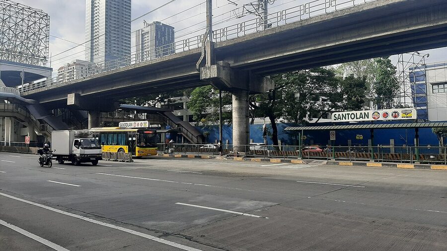 EDSA Carousel Santolan station with bus and overhead flyover in Manila