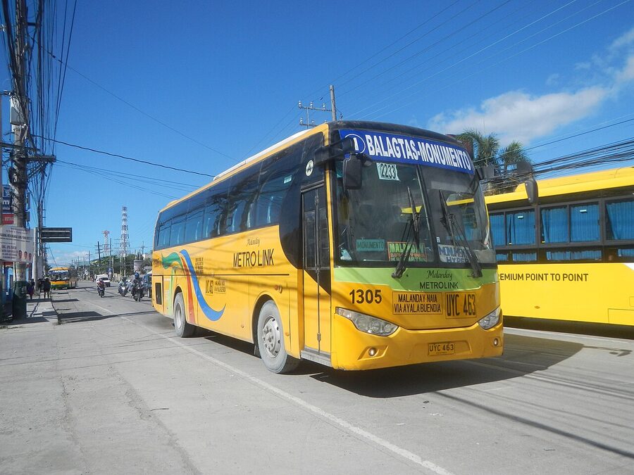 Yellow Premium Point-to-Point P2P bus in Manila with destination signage