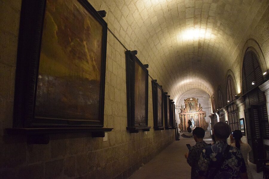 The painted vaulted ceiling and chandeliers of San Agustin Church nave, Intramuros, Manila