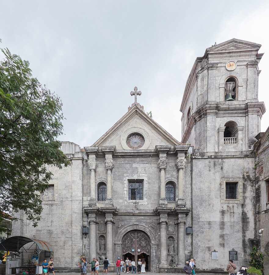 The Baroque facade of San Agustin Church in Intramuros with its asymmetrical bell tower and stone columns