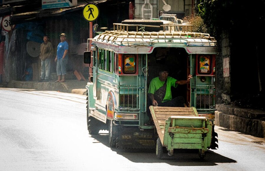 A traditional Filipino jeepney travelling through a city street in Manila
