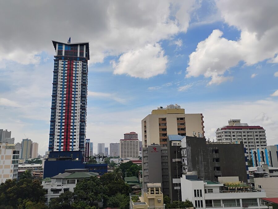 Tall residential tower above the Malate skyline near Sheraton Manila Bay