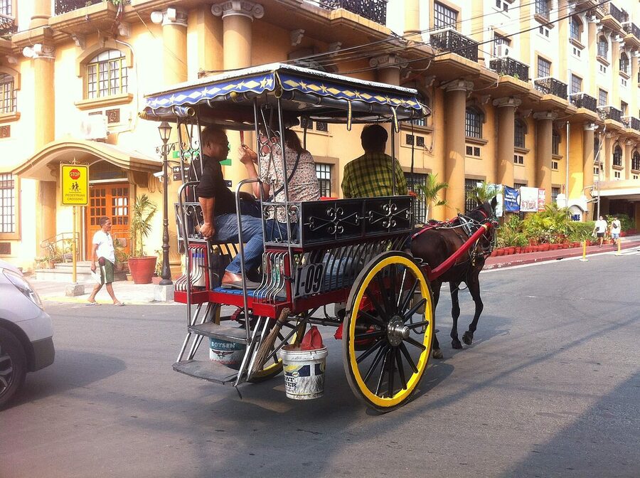 Kalesa horse-drawn carriage at the entrance to Intramuros, Manila