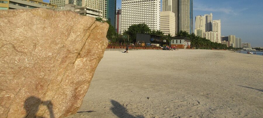 Manila Baywalk dolomite sand and city skyline