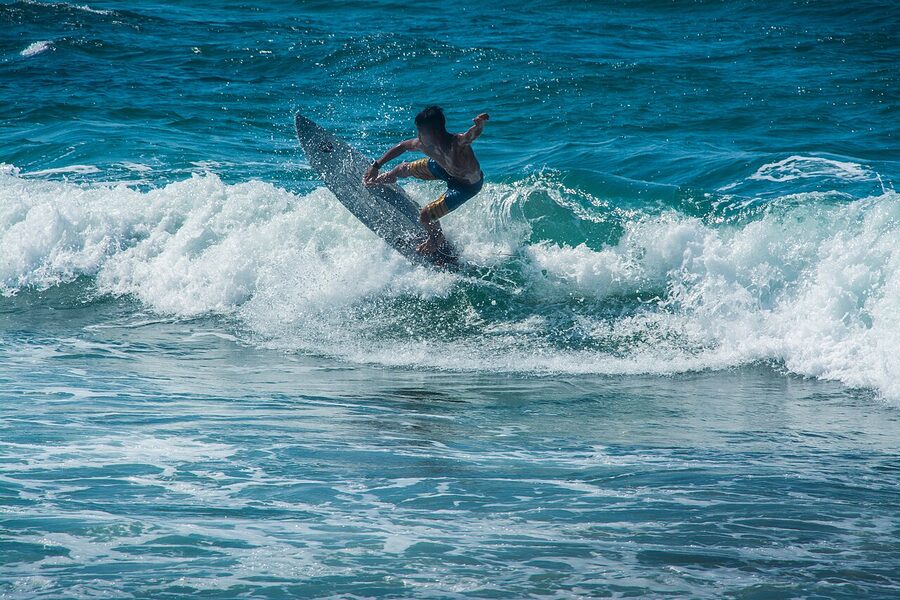 Surfer on a wave at San Juan, La Union, Philippines