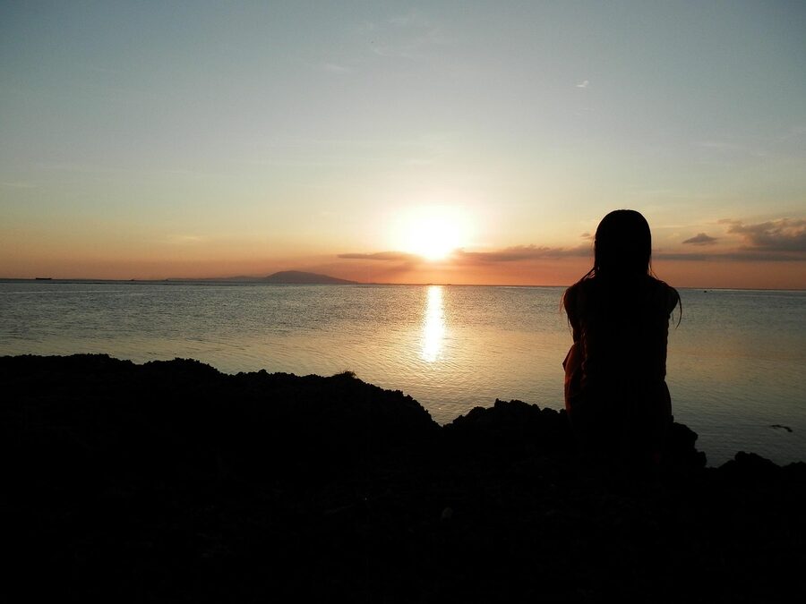 Burot Beach in Calatagan, Batangas with outrigger boat at sunset