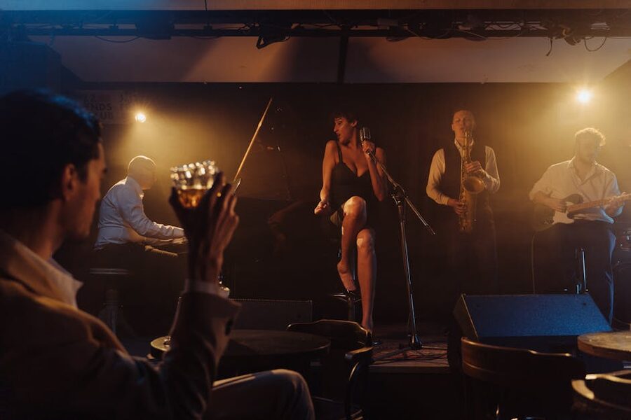 Jazz band performing live on a small stage in a dim bar