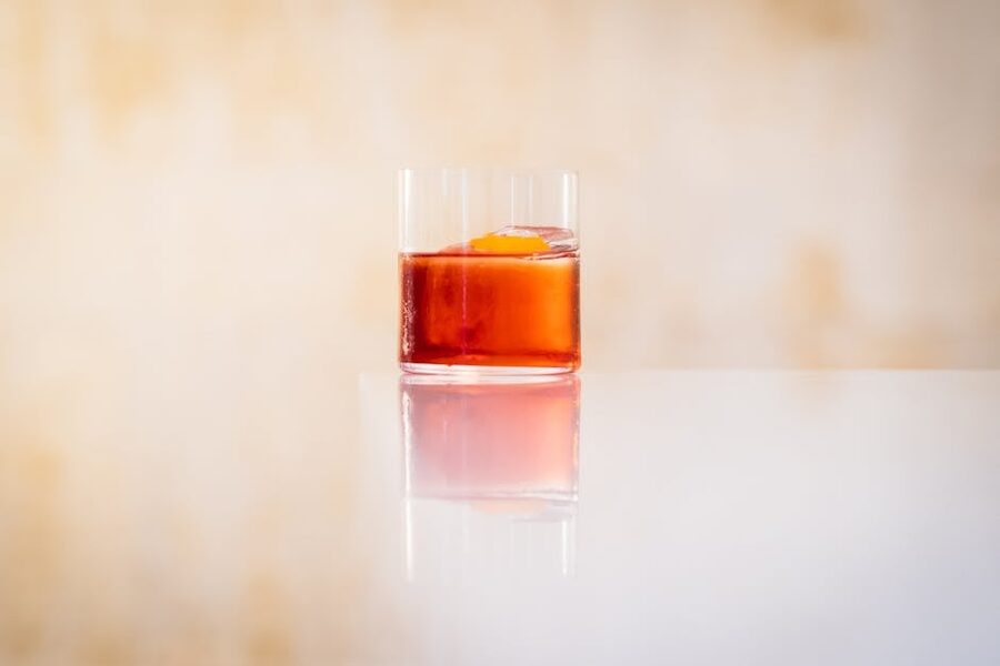 Negroni cocktail with orange peel garnish in a coupe glass