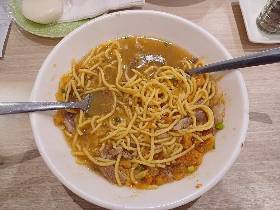 A bowl of Iloilo La Paz batchoy noodle soup at Ted's Oldtimer with pork liver chicharon and noodles