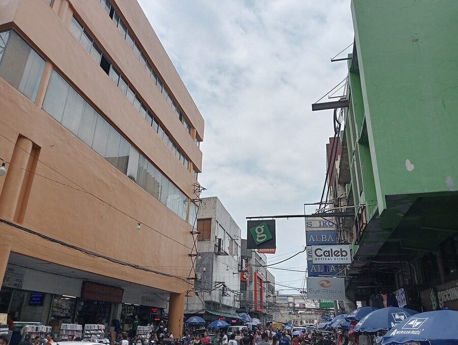Carriedo Street in Quiapo Manila with old commercial buildings and street-level shopfronts