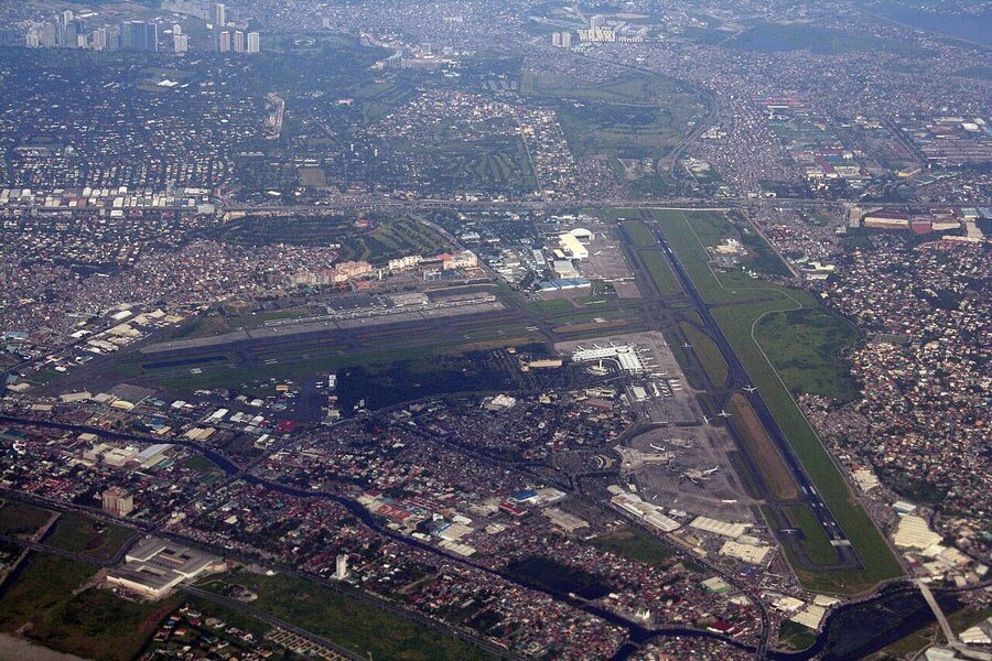 Aerial view of Ninoy Aquino International Airport in Manila with runways and terminal buildings
