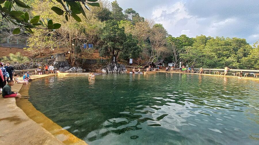 Stone-lined hot spring pool surrounded by mangroves at Maquinit, Coron, Palawan