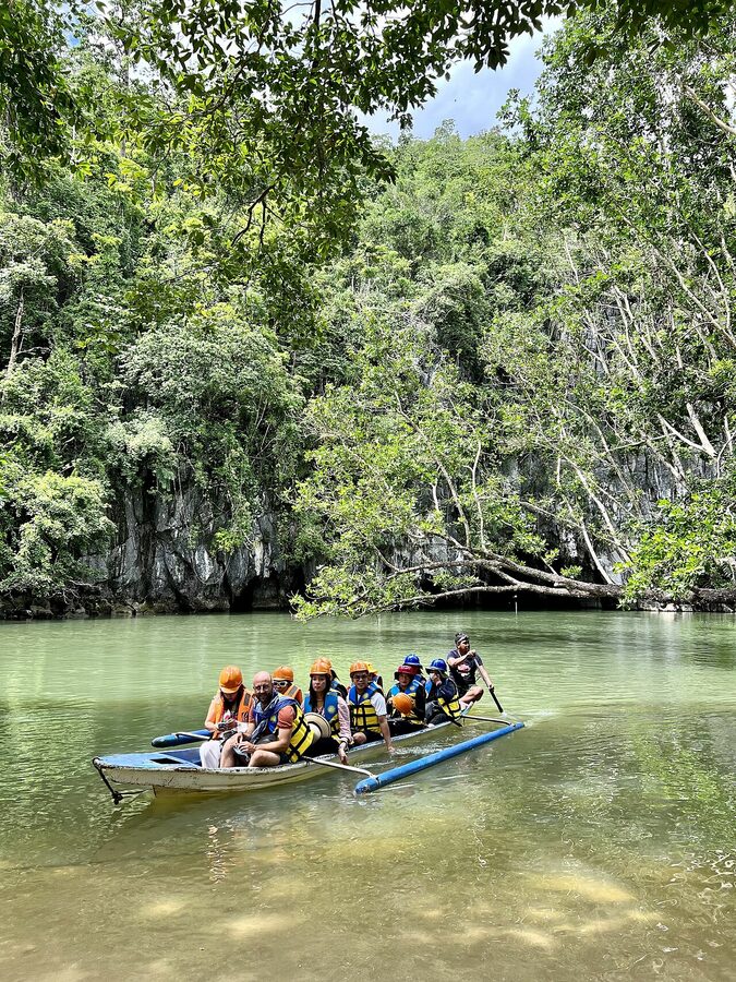 Tourists in a paddle boat on the Puerto Princesa Underground River entrance, Palawan