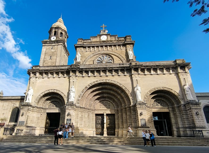 Manila Cathedral facade in Intramuros under blue sky