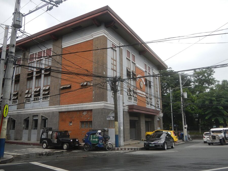 Street corner in Poblacion Makati with brick and stone barangay building
