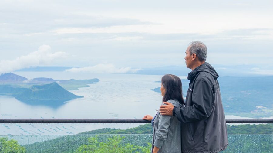 Couple at a Tagaytay lookout admiring Taal Lake