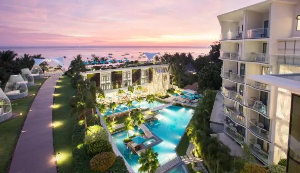 The Lind Boracay pool and palm reflection at twilight