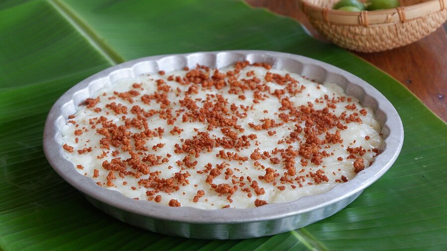 Tibok tibok carabao milk dessert with latik on banana leaf