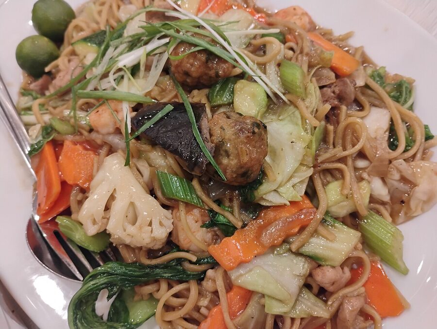 Pancit guisado stir-fried noodles with vegetables, shrimp and meat at a Manila restaurant