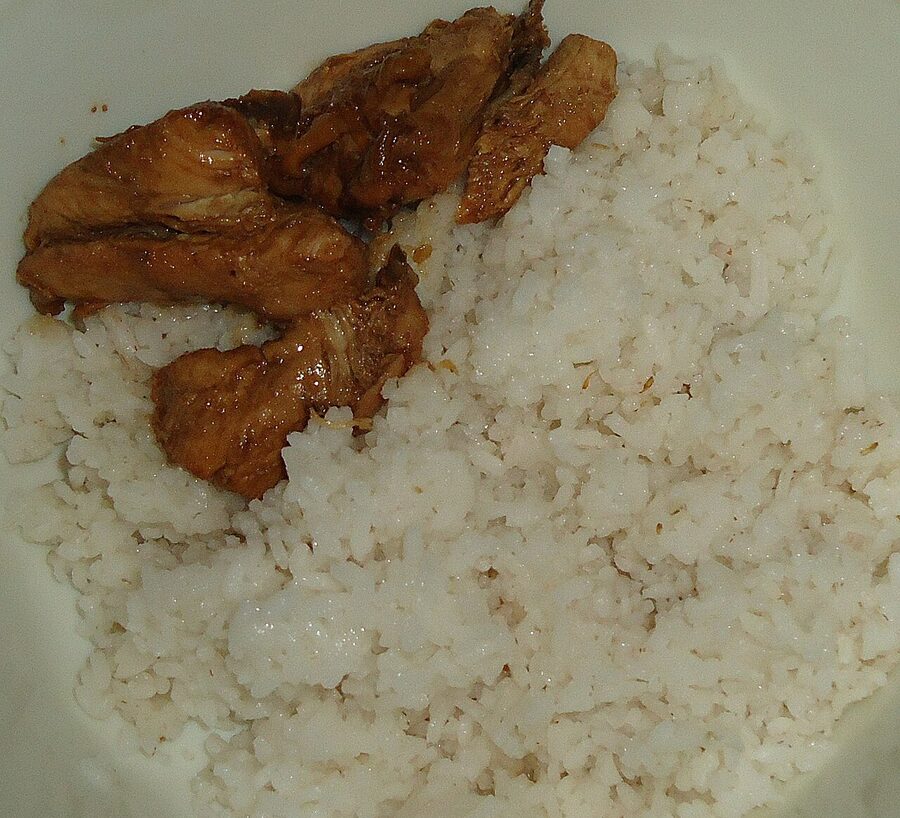 Filipino chicken adobo with sauce served over white rice