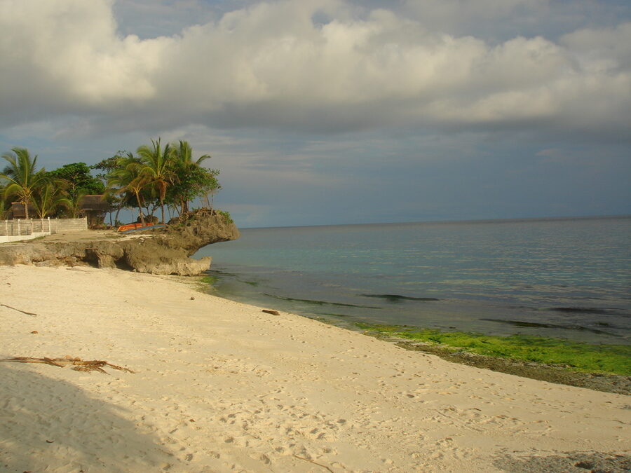 Anda Beach white sand and outrigger boats on east coast of Bohol