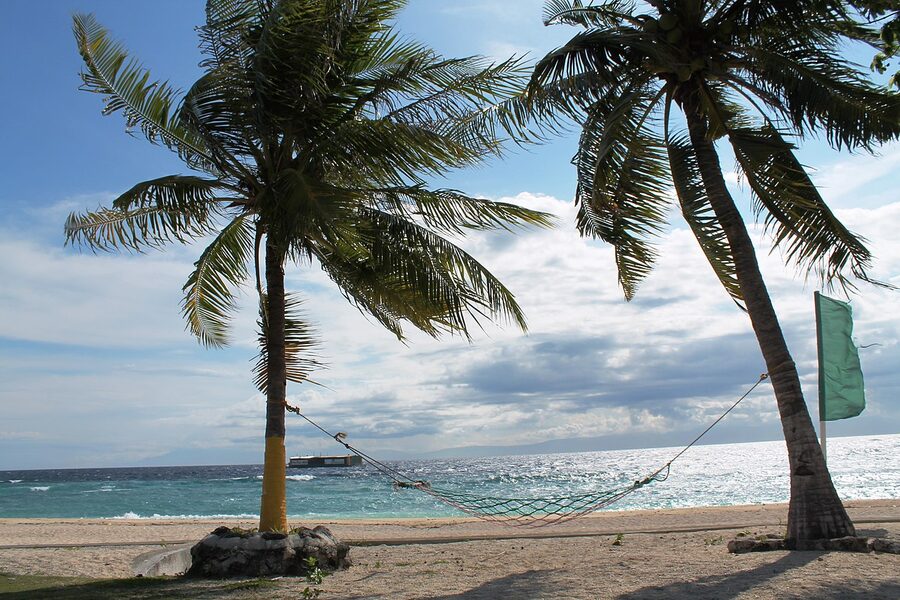 Balicasag Island in Panglao Bohol with reef and outrigger boats