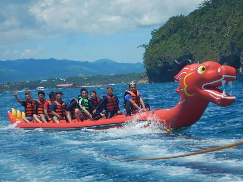 Boracay: Inflatable Banana or Dragon Boat Ride - Leaving White Beach by speedboat
