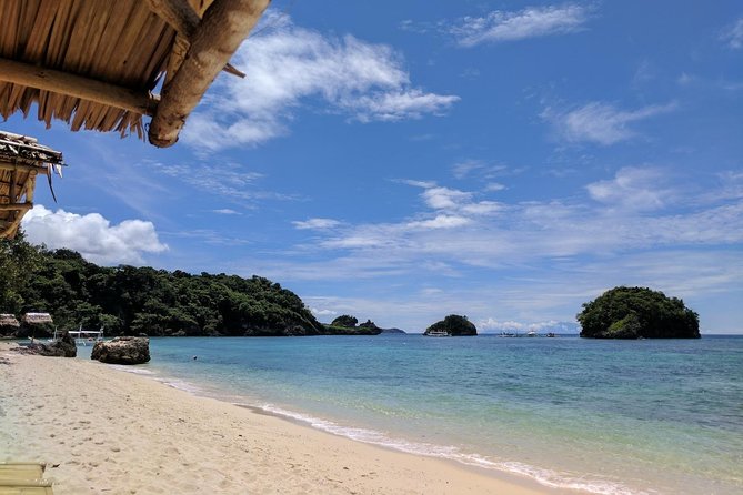 Boracay Island Hopping + Hot Kawa + Parasailing + Helmet Diving - Crystal Cove and Magic Island cost extra