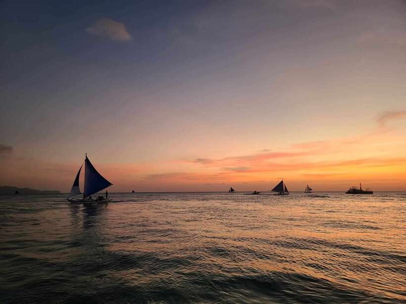 Boracay Sunset Boat Party Experience - Boarding a yacht for a three-hour outing