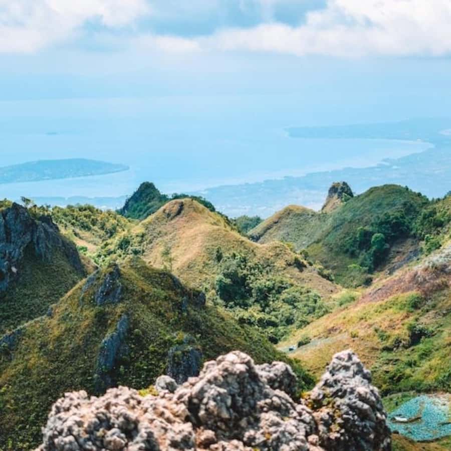 Cebu: Osmeña Peak and Kawasan Canyoneering Day Tour - Climbing Osmeña Peak near Mantalongon