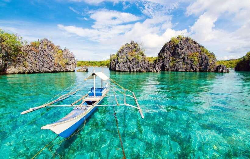 Coron: Coastal Cliffs, Beach & Malcapuya Island Hopping Tour - Setting out from downtown Coron