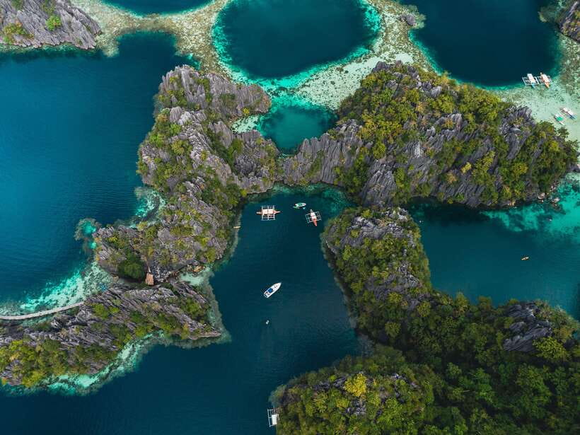 Coron: Private Island-Hopping Tour on a Yacht or Speedboat - Setting out from Coron Harbor Square