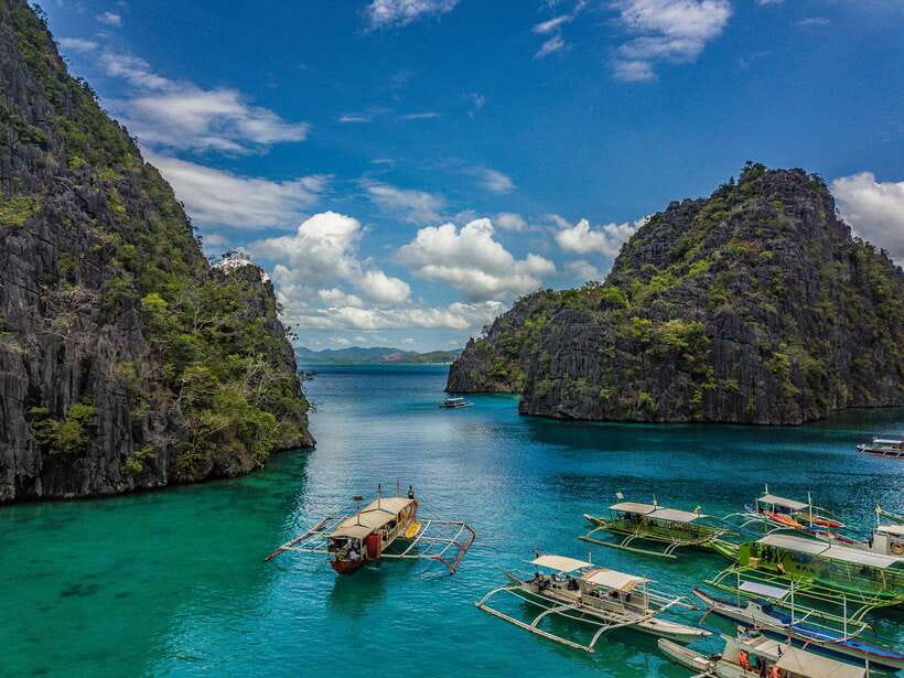 From Coron: Island Hopping Boat Day Trip with Buffet Lunch - Lunch on the beach, with one useful caveat
