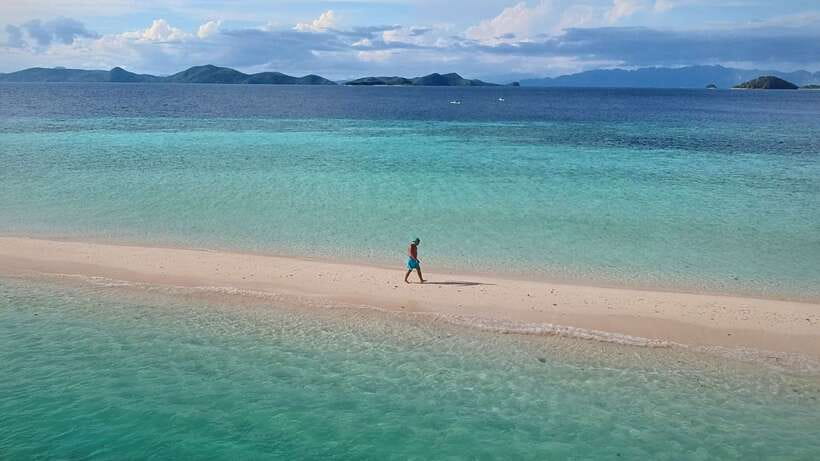 From Coron: Private Island-Hopping Cruise with Lunch - Banana Island and its curved beach