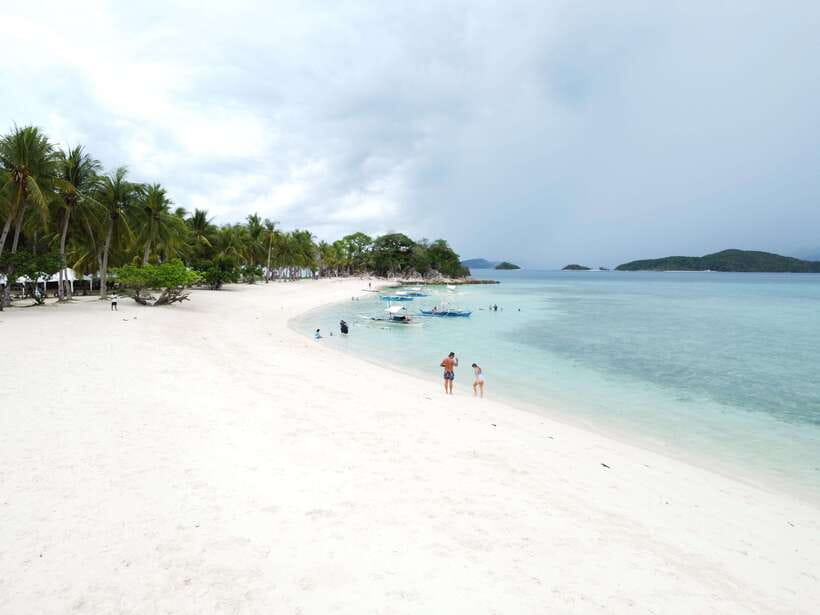 From Coron Town: Beaches and Islands Boat Tour with Lunch - The boat, guide, and group experience