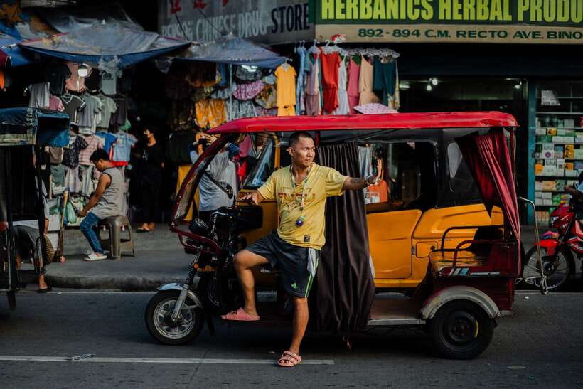 Manila: Guided Tuk Tuk Ride - Walking through neighborhoods beyond the usual route