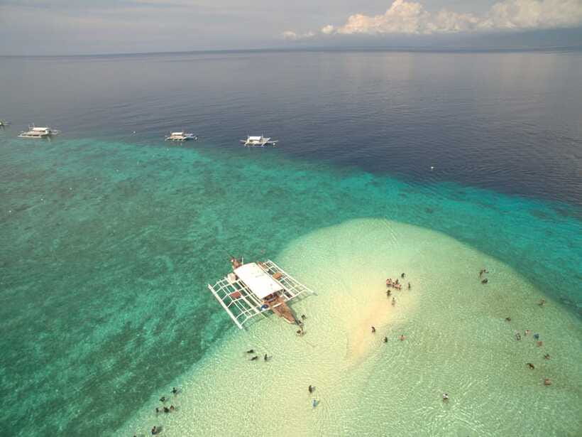 Siargao Island Hopping: Tri Island Tour - Shared and Private - Guyam Island ends the day under the palms